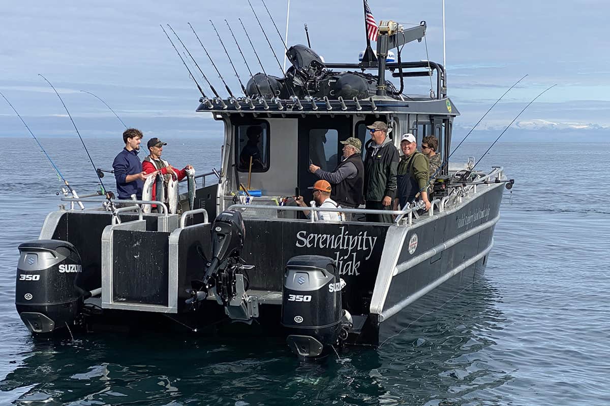 Serendipity boat with rods and fishermen and fish