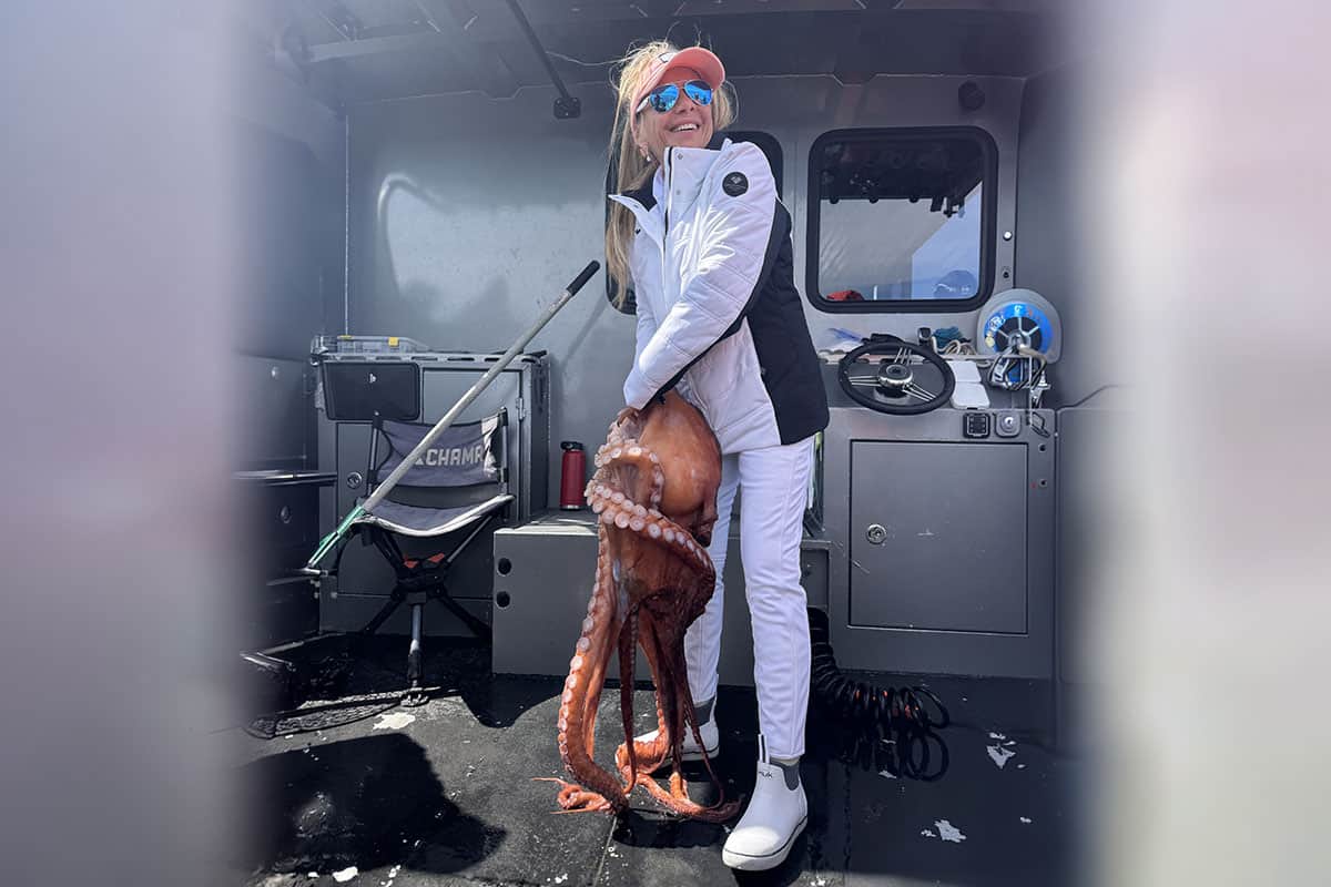 smiling woman in white and black with octopus